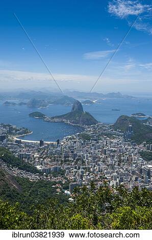 "Outlook from the Christ the Redeemer statue over Rio de Janeiro and the Sugar Loaf, Brazil, South America" View Large Photo Image Stock Photo - "Outlook from the Christ the Redeemer statue over Rio de Janeiro and the Sugar Loaf, Brazil, South America". Fotosearch
