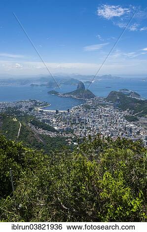 "Outlook from the Christ the Redeemer statue over Rio de Janeiro and the Sugar Loaf, Brazil, South America" View Large Photo Image Stock Photograph - "Outlook from the Christ the Redeemer statue over Rio de Janeiro and the Sugar Loaf, Brazil, South America". Fotosearch