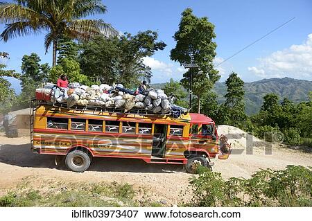 "Overcrowded bus on a dusty road in the mountains, Leogane, Haiti, North America" View Large Photo Image Stock Photo - "Overcrowded bus on a dusty road in the mountains, Leogane, Haiti, North America". Fotosearch
