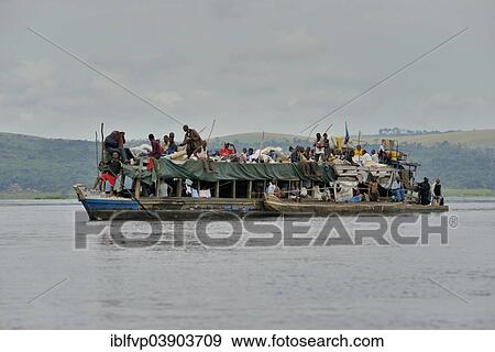 "Overloaded boat on the Congo River, near Tshumbiri, Bandundu Province, Democratic Republic of the Congo" View Large Photo Image Stock Photo - "Overloaded boat on the Congo River, near Tshumbiri, Bandundu Province, Democratic Republic of the Congo". Fotosearch