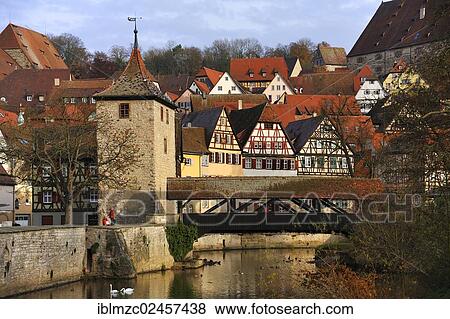 "Overlooking the historic town centre of Schwaebisch Hall with Sulferturm tower and the Sulfersteg covered wooden footbridge crossing the Kocher River, Schwaebisch Hall, Baden-Wuerttemberg, Germany, Europe, PublicGround, Europe" View Large Photo Image Stock Photo - "Overlooking the historic town centre of Schwaebisch Hall with Sulferturm tower and the Sulfersteg covered wooden footbridge crossing the Kocher River, Schwaebisch Hall, Baden-Wuerttemberg, Germany, Europe, PublicGround, Europe". Fotosearch