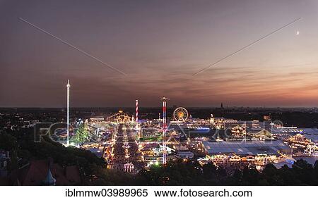 Stock Photography - "Overlooking the Oktoberfest, evening mood, Munich, Upper Bavaria, Bavaria, Germany, Europe". Fotosearch
