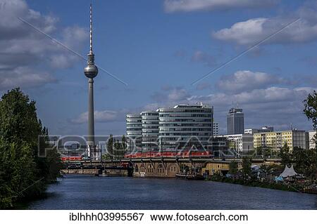Stock Photo - "Overlooking the Spree river towards Berlin TV Tower and the building of the Berliner Verkehrsbetriebe, BVG, Berlin Transport Services, Friedrichshain, Berlin, Germany, Europe". Fotosearch