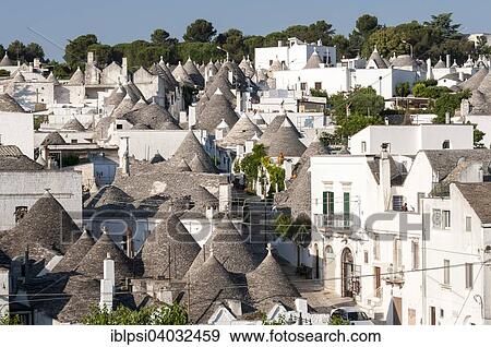"Overlooking the Trulli houses, Rione Monti Distrikt, Alberobello, Apulia, Italy, Europe" View Large Photo Image Stock Photo - "Overlooking the Trulli houses, Rione Monti Distrikt, Alberobello, Apulia, Italy, Europe". Fotosearch