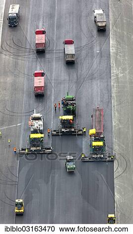 Stock Image - "Paderborn Airport, construction work on the runway, construction vehicles, runway rehabilitation, aerial view, Buren, Paderborn, North Rhine-Westphalia, Germany, Europe". Fotosearch