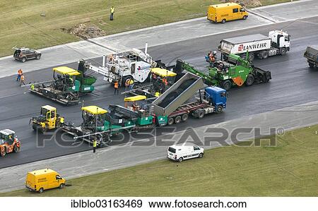 Stock Photo - "Paderborn Airport, construction work on the runway, construction vehicles, runway rehabilitation, aerial view, Buren, Paderborn, North Rhine-Westphalia, Germany, Europe". Fotosearch