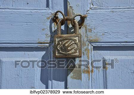 Stock Photo - "Padlock with a dove as a door handle on a light blue door, Karterados, Santorini, Cyclades, Greek Islands, Greece, Europe". Fotosearch