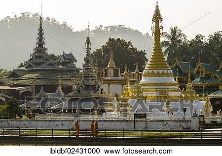 "Pagoda or Chedi, Buddhist monks walking in front of the Temples of Wat Jong Kham and Chong Kham or Wat Jong Klang and Chong Klang, Mae Hong Son, Northern Thailand, Thailand, Asia" View Large Photo Image Stock Image - "Pagoda or Chedi, Buddhist monks walking in front of the Temples of Wat Jong Kham and Chong Kham or Wat Jong Klang and Chong Klang, Mae Hong Son, Northern Thailand, Thailand, Asia". Fotosearch