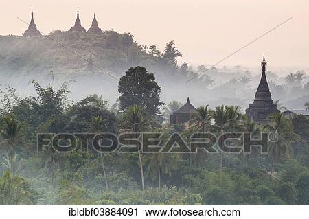 "Pagodas and temples surrounded by trees, in the mist, Mrauk U, Sittwe District, Rakhine State, Myanmar, Asia" View Large Photo Image Stock Image - "Pagodas and temples surrounded by trees, in the mist, Mrauk U, Sittwe District, Rakhine State, Myanmar, Asia". Fotosearch