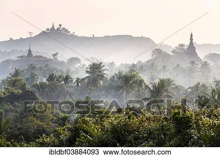 "Pagodas and temples surrounded by trees, in the mist, Mrauk U, Sittwe District, Rakhine State, Myanmar, Asia" View Large Photo Image Stock Image - "Pagodas and temples surrounded by trees, in the mist, Mrauk U, Sittwe District, Rakhine State, Myanmar, Asia". Fotosearch