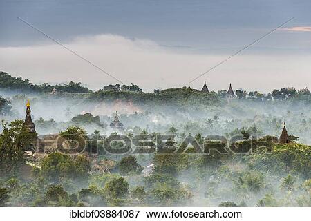 "Pagodas and temples surrounded by trees, in the mist, Mrauk U, Sittwe District, Rakhine State, Myanmar, Asia" View Large Photo Image Stock Photo - "Pagodas and temples surrounded by trees, in the mist, Mrauk U, Sittwe District, Rakhine State, Myanmar, Asia". Fotosearch