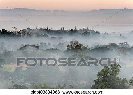 "Pagodas and temples surrounded by trees, in the mist, Mrauk U, Sittwe District, Rakhine State, Myanmar, Asia" View Large Photo Image Stock Photo - "Pagodas and temples surrounded by trees, in the mist, Mrauk U, Sittwe District, Rakhine State, Myanmar, Asia". Fotosearch
