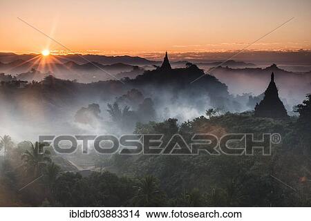 "Pagodas surrounded by trees, at sunrise, in the mist, Mrauk U, Sittwe District, Rakhine State, Myanmar, Asia" View Large Photo Image Picture - "Pagodas surrounded by trees, at sunrise, in the mist, Mrauk U, Sittwe District, Rakhine State, Myanmar, Asia". Fotosearch