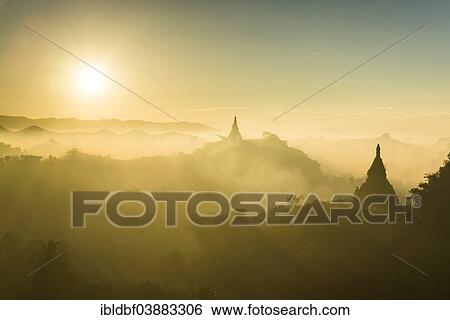 "Pagodas surrounded by trees, at sunrise, in the mist, Mrauk U, Sittwe District, Rakhine State, Myanmar, Asia" View Large Photo Image Stock Photograph - "Pagodas surrounded by trees, at sunrise, in the mist, Mrauk U, Sittwe District, Rakhine State, Myanmar, Asia". Fotosearch