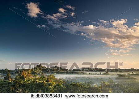 "Pagodas surrounded by trees, in the mist, Mrauk U, Sittwe District, Rakhine State, Myanmar, Asia" View Large Photo Image Stock Image - "Pagodas surrounded by trees, in the mist, Mrauk U, Sittwe District, Rakhine State, Myanmar, Asia". Fotosearch