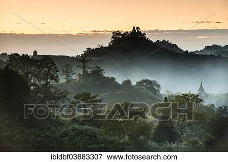 "Pagodas surrounded by trees, in the mist, in the morning light, Mrauk U, Sittwe District, Rakhine State, Myanmar, Asia" View Large Photo Image Stock Photo - "Pagodas surrounded by trees, in the mist, in the morning light, Mrauk U, Sittwe District, Rakhine State, Myanmar, Asia". Fotosearch