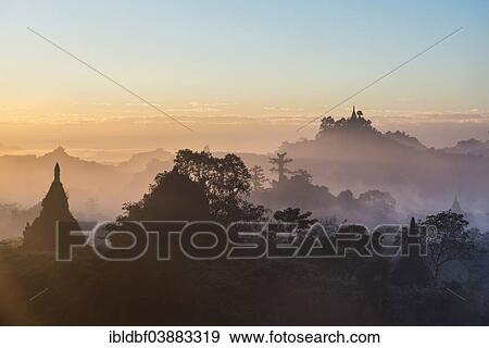 "Pagodas surrounded by trees, in the mist, in the morning light, Mrauk U, Sittwe District, Rakhine State, Myanmar, Asia" View Large Photo Image Stock Photo - "Pagodas surrounded by trees, in the mist, in the morning light, Mrauk U, Sittwe District, Rakhine State, Myanmar, Asia". Fotosearch
