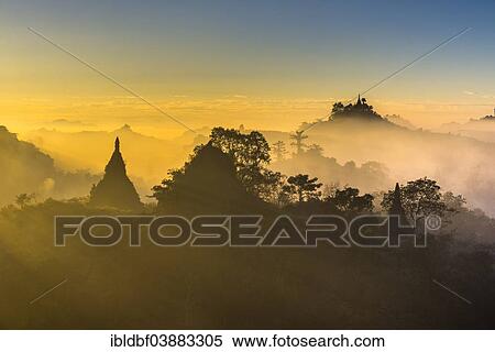 "Pagodas surrounded by trees, in the mist, in the morning light, Mrauk U, Sittwe District, Rakhine State, Myanmar, Asia" View Large Photo Image Stock Photography - "Pagodas surrounded by trees, in the mist, in the morning light, Mrauk U, Sittwe District, Rakhine State, Myanmar, Asia". Fotosearch