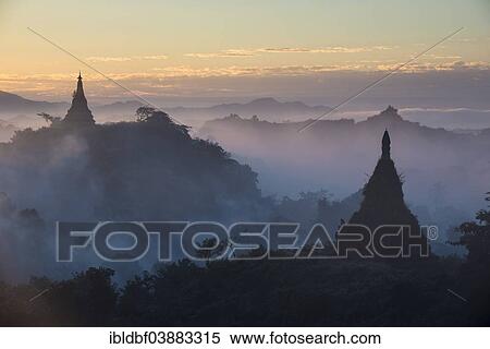 "Pagodas surrounded by trees, in the mist, Mrauk U, Sittwe District, Rakhine State, Myanmar, Asia" View Large Photo Image Stock Photography - "Pagodas surrounded by trees, in the mist, Mrauk U, Sittwe District, Rakhine State, Myanmar, Asia". Fotosearch