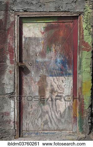 Stock Image - "Paint-smeared door of a fisherman's hut, Ponta do Sol, Santo Antao island, Cape Verde, Africa". Fotosearch