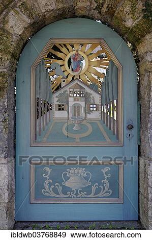 "Painted and carved gate in a garden wall, Wessling, Upper Bavaria, Bavaria, Germany, Europe" View Large Photo Image Stock Photo - "Painted and carved gate in a garden wall, Wessling, Upper Bavaria, Bavaria, Germany, Europe". Fotosearch