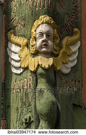 Painted Angel Figure Carved Into A Corner Post Half Timbered