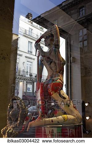 "Painted shop-window mannequin in the shop window of an art gallery, Rue Rivoli street, 1st arrondissement, Paris, Ile-de-France, France, Europe" View Large Photo Image Stock Image - "Painted shop-window mannequin in the shop window of an art gallery, Rue Rivoli street, 1st arrondissement, Paris, Ile-de-France, France, Europe". Fotosearch