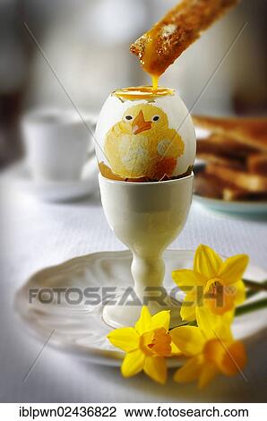 Painted traditional Easter egg decorated with a chicken illustration being eaten for breakfast View Large Photo Image Stock Image - Painted traditional Easter egg decorated with a chicken illustration being eaten for breakfast. Fotosearch