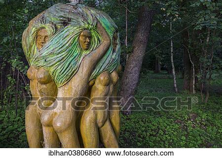 "Painted wooden sculpture, Mazurski Eden or Masurian Garden of Eden, reconstruction of Galindian culture, Gmina Ruciane-Nida, Warmian-Masurian Voivodeship, Poland, Europe" View Large Photo Image Stock Image - "Painted wooden sculpture, Mazurski Eden or Masurian Garden of Eden, reconstruction of Galindian culture, Gmina Ruciane-Nida, Warmian-Masurian Voivodeship, Poland, Europe". Fotosearch