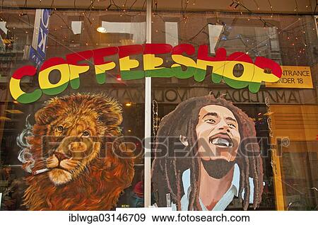 Stock Photo - "Painting of a smoking lion and the singer Bob Marley, on the window of a coffee shop, Amsterdam, province of North Holland, The Netherlands, Europe". Fotosearch