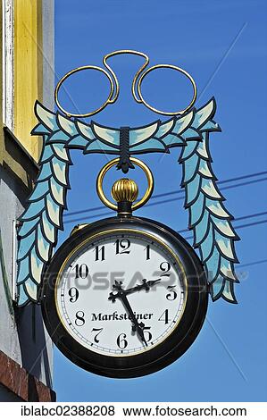 "Pair of pince-nez and a pocket watch, hanging sign for an optician and watchmaker in Kochel am See, Bavaria, Germany, Europe" View Large Photo Image Stock Photo - "Pair of pince-nez and a pocket watch, hanging sign for an optician and watchmaker in Kochel am See, Bavaria, Germany, Europe". Fotosearch