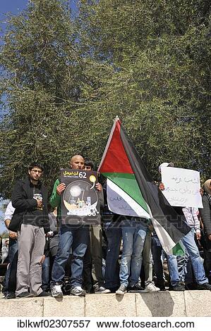 Stock Photo - "Palestinians demonstrating peacefully with placards and posters against the Israeli settlement policy at the Damascus Gate outside the Old City, Jerusalem, Israel, Middle East, Southwest Asia, Asia". Fotosearch