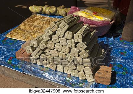 "Palm sugar packed in palm leaves for sale at a market stall, Siem Reap, Cambodia, Southeast Asia, Asia" View Large Photo Image Stock Photo - "Palm sugar packed in palm leaves for sale at a market stall, Siem Reap, Cambodia, Southeast Asia, Asia". Fotosearch