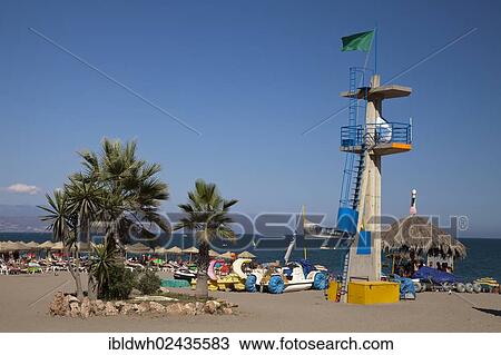 "Palm trees and the tower of the lifeguards on Hawaii Playa beach, Torremolinos, Malaga province, Costa del Sol, Andalusia, Spain, Europe, PublicGround, Europe" View Large Photo Image Stock Image - "Palm trees and the tower of the lifeguards on Hawaii Playa beach, Torremolinos, Malaga province, Costa del Sol, Andalusia, Spain, Europe, PublicGround, Europe". Fotosearch