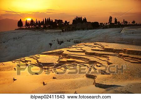 Pamukkale travetine terrace, white calcium carbonate rock formations, at sunset, Turkey, Asia View Large Photo Image Stock Image - Pamukkale travetine terrace, white calcium carbonate rock formations, at sunset, Turkey, Asia. Fotosearch