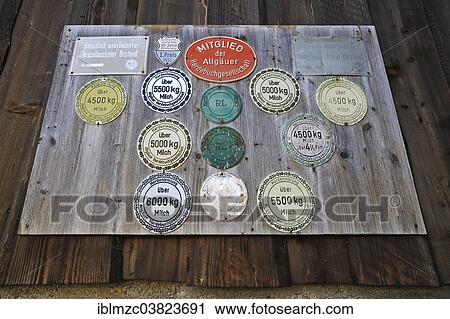 "Panel with award plaques for milk yield on a cowshed, Bad Hindelang, Upper Allgau, Bavaria, Germany, Europe" View Large Photo Image Stock Image - "Panel with award plaques for milk yield on a cowshed, Bad Hindelang, Upper Allgau, Bavaria, Germany, Europe". Fotosearch