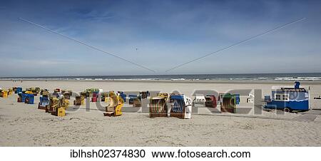 "Panoramic view of the beach, roofed wicker beach chairs on the beach of Juist island, North Sea, Lower Saxony Wadden Sea, East Frisia, Lower Saxony, Germany, Europe" View Large Photo Image Stock Image - "Panoramic view of the beach, roofed wicker beach chairs on the beach of Juist island, North Sea, Lower Saxony Wadden Sea, East Frisia, Lower Saxony, Germany, Europe". Fotosearch