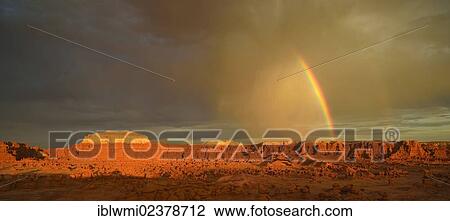 "Panoramic view, rainbow during a thunderstorm, eroded hoodoos and Entrada Sandstone rock formations, Goblins, Goblin Valley State Park, San Rafael Reef Desert, Utah, Southwestern USA, USA" View Large Photo Image Stock Image - "Panoramic view, rainbow during a thunderstorm, eroded hoodoos and Entrada Sandstone rock formations, Goblins, Goblin Valley State Park, San Rafael Reef Desert, Utah, Southwestern USA, USA". Fotosearch