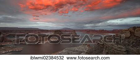 Stock Image - "Panoramic view, view after sunset from Alstrom Point to Lake Powell illuminated by clouds, Padre Bay with Gunsight Butte and Navajo Mountain, Bigwater, Glen Canyon National Recreation Area, Arizona, Southwestern USA, Utah, USA". Fotosearch