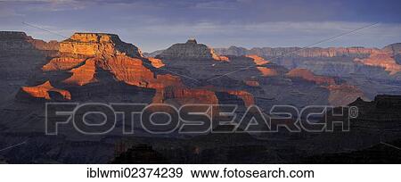 Stock Photo - "Panoramic view with the Vishnu Temple as seen from Yavapai Point Lookout at sunset, Desert Palisades, Wotan's Throne, Comanche Point, evening light, Grand Canyon National Park, Arizona, USA". Fotosearch