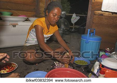 "Papuan woman preparing food, Runi Island, Biak, West Papua, Indonesia, Asia" View Large Photo Image Picture - "Papuan woman preparing food, Runi Island, Biak, West Papua, Indonesia, Asia". Fotosearch