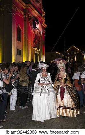 "Parade of mask wearers in front of the historic municipal church, Venetian Fair, on the historic Marktplatz market square, Ludwigsburg, Baden-Wuerttemberg, Germany, Europe" View Large Photo Image Stock Photo - "Parade of mask wearers in front of the historic municipal church, Venetian Fair, on the historic Marktplatz market square, Ludwigsburg, Baden-Wuerttemberg, Germany, Europe". Fotosearch