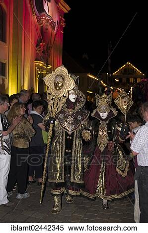 Stock Photography - "Parade of mask wearers in front of the historic municipal church, Venetian Fair, on the historic Marktplatz market square, Ludwigsburg, Baden-Wuerttemberg, Germany, Europe". Fotosearch
