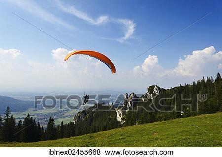 "Paraglider at Mount Kampenwand, Chiemgau region, Upper Bavaria, Bavaria, Germany, Europe" View Large Photo Image Stock Photo - "Paraglider at Mount Kampenwand, Chiemgau region, Upper Bavaria, Bavaria, Germany, Europe". Fotosearch
