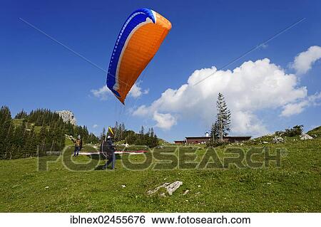 Stock Photograph - "Paraglider, Mt Kampenwand, Chiemgau region, Upper Bavaria, Bavaria, Germany, Europe". Fotosearch