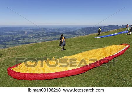 Stock Photo - "Paraglider taking off, Berg Niedere, Andelsbuch, Bregenzerwald, Bregenzer Wald, Vorarlberg, Austria, Europe". Fotosearch