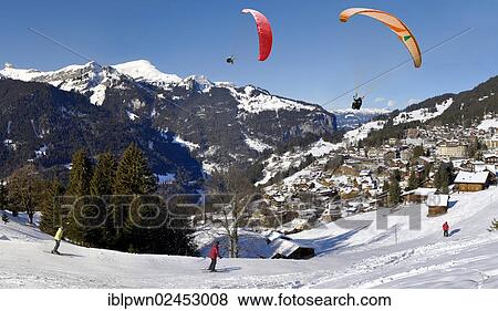 "Paragliders above Wengen, Swiss Alps, Switzerland, Europe" View Large Photo Image Stock Photo - "Paragliders above Wengen, Swiss Alps, Switzerland, Europe". Fotosearch