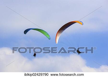 "Paragliders in the air, Dolomites, Trentino, Italy, Europe" View Large Photo Image Stock Image - "Paragliders in the air, Dolomites, Trentino, Italy, Europe". Fotosearch
