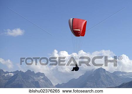 "Paragliding over the Valais Alps, Goms, Switzerland, Europe" View Large Photo Image Stock Photography - "Paragliding over the Valais Alps, Goms, Switzerland, Europe". Fotosearch