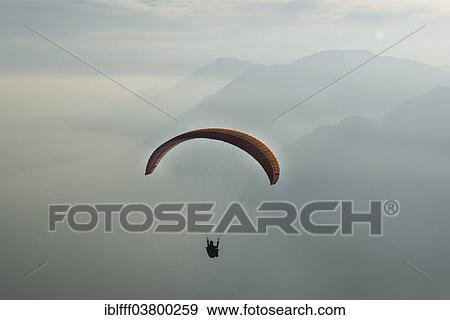 "Paragliding, paraglider, clouds, inversion, Lake Garda, Veneto, Italy, Europe" View Large Photo Image Stock Photo - "Paragliding, paraglider, clouds, inversion, Lake Garda, Veneto, Italy, Europe". Fotosearch